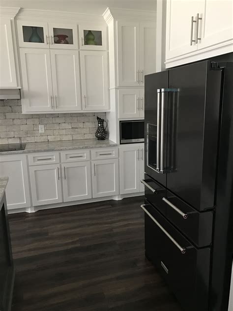 dark grey cabinets with stainless steel appliances|black and white kitchen appliances.